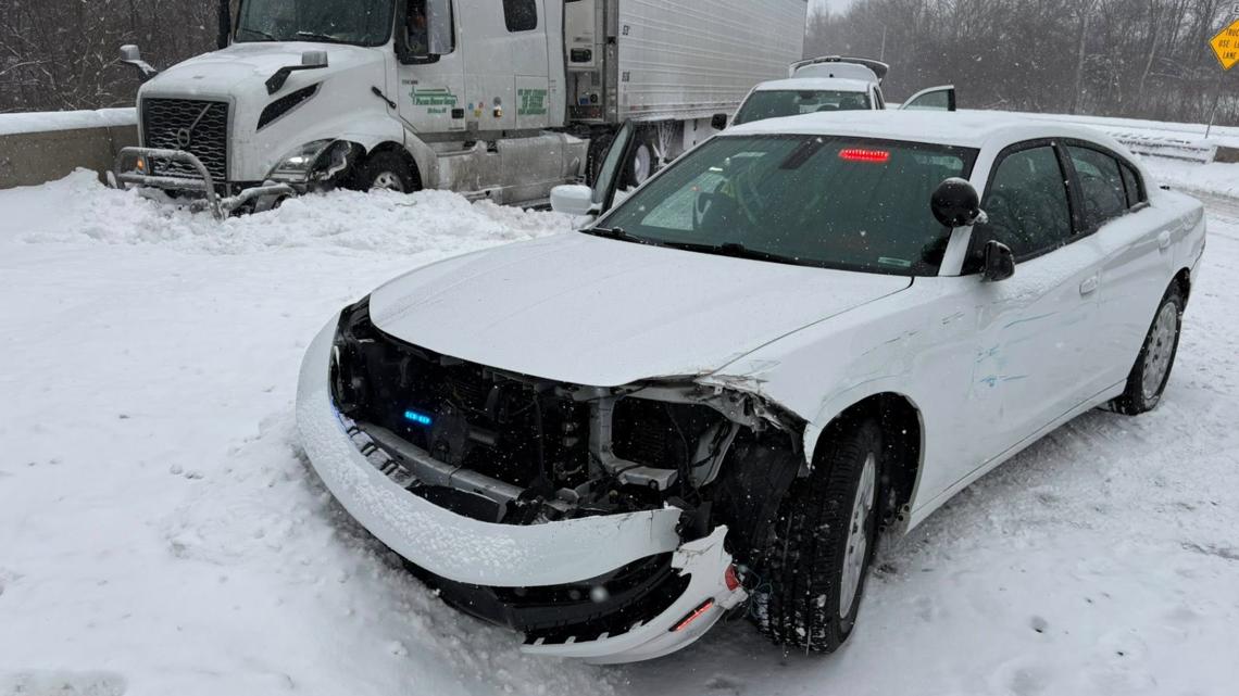 ISP car struck by 2 semis on I-70 while trooper assisted stuck family