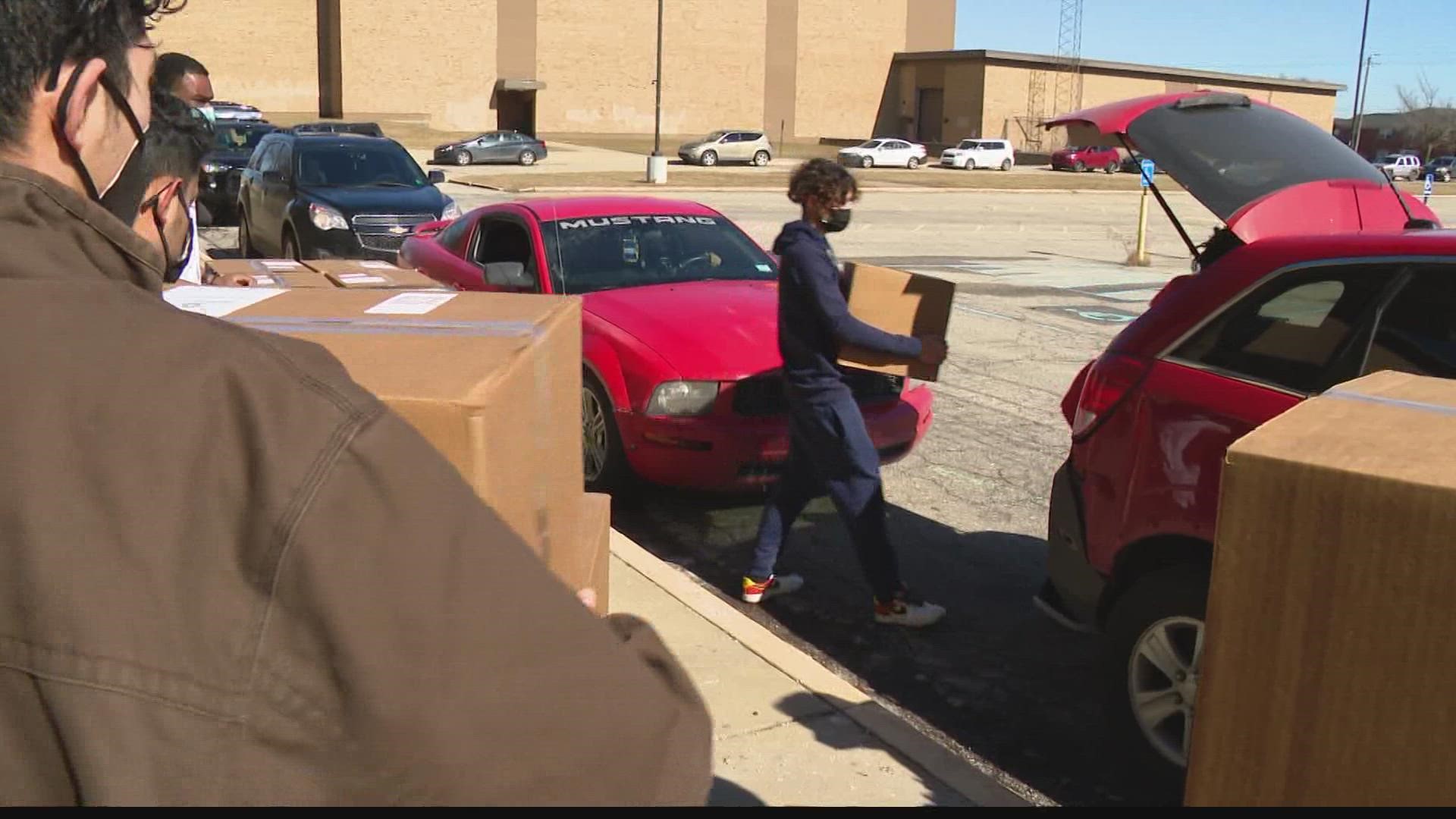 Students, teachers, staff and community members gave out 400 boxes of food on Saturday.