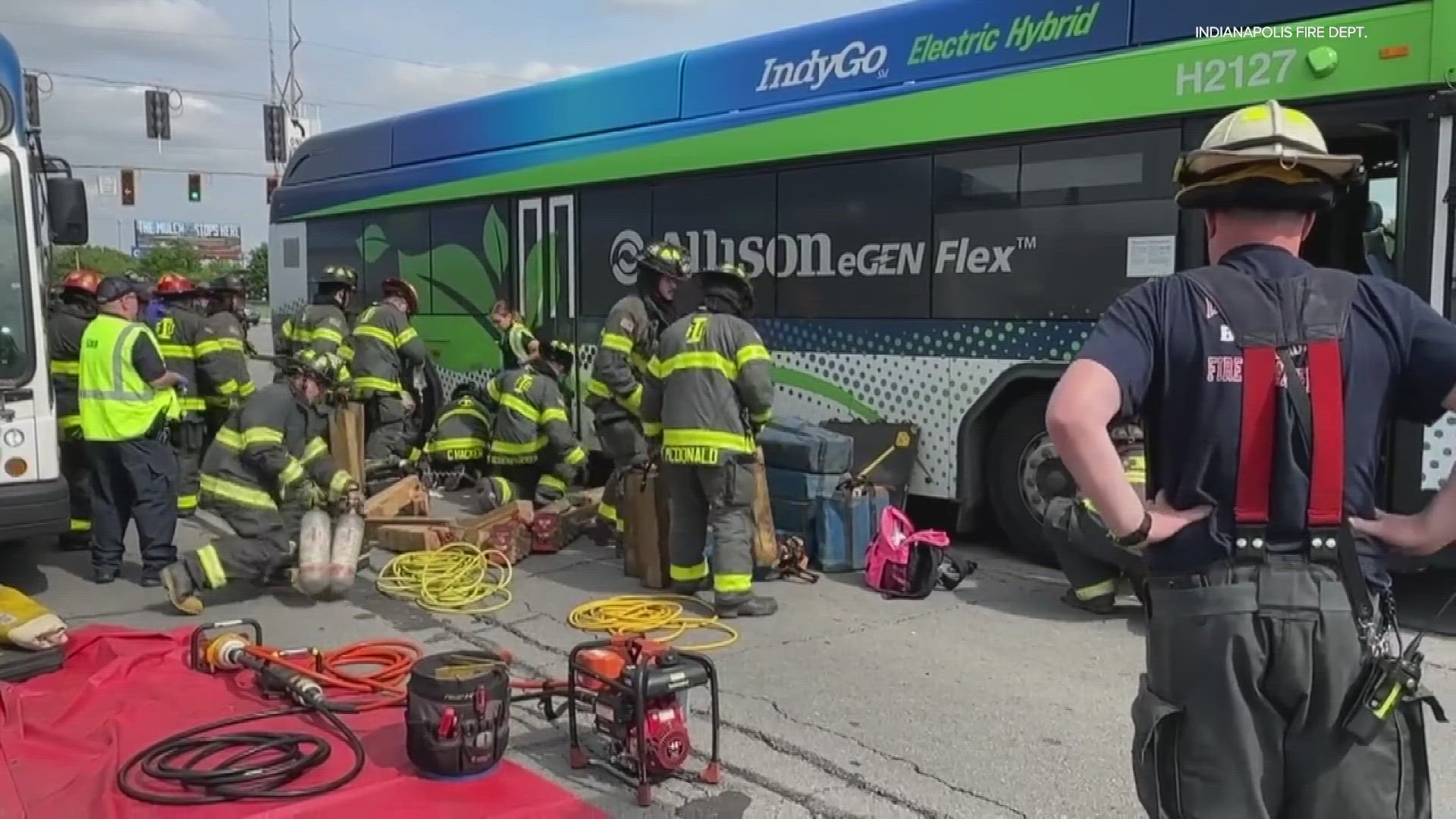 Police received a report that the woman refused to get off of a bus, then became pinned under the tires of a second bus as it drove away.