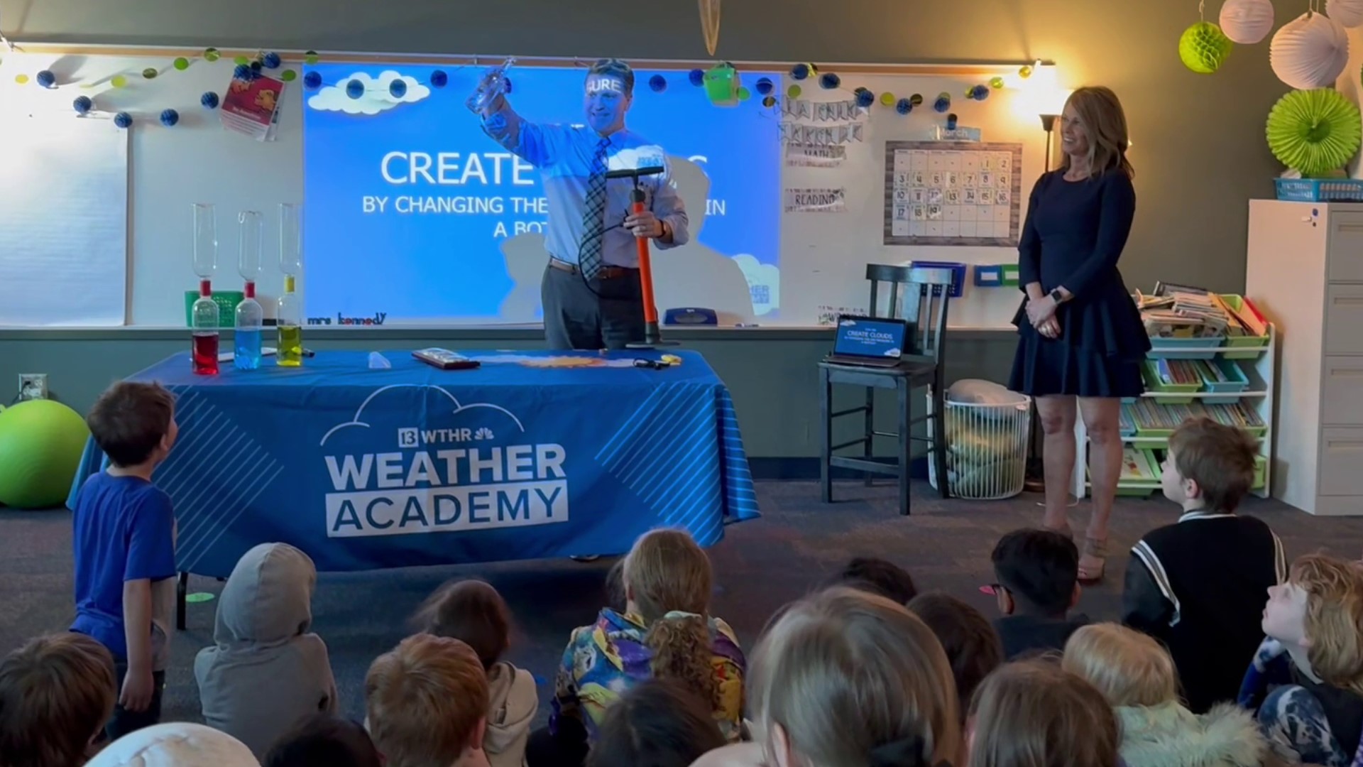 Meteorologists Angela Buchman and Sean Ash spoke to second graders about the weather.