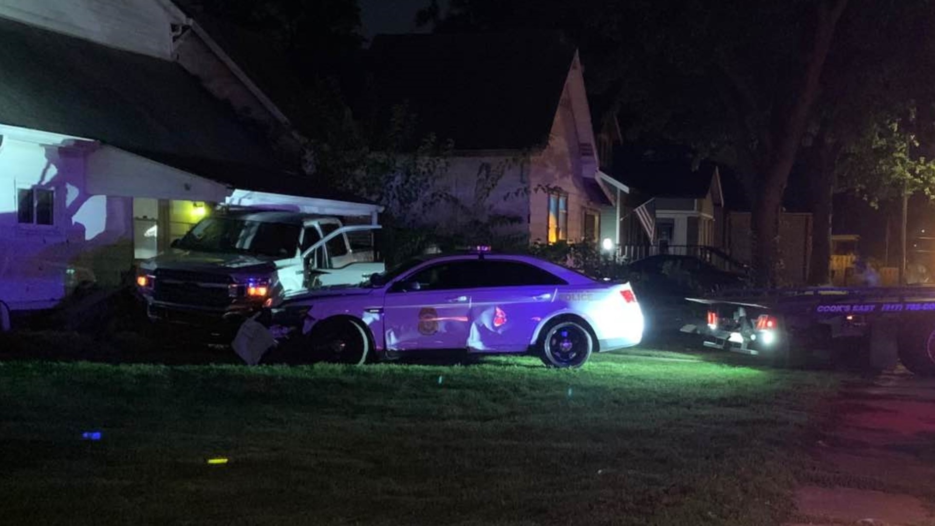 The pursuit began around 12:30 a.m. and ended when the suspect's truck struck a house in the 2100 block of South Pennsylvania Street.