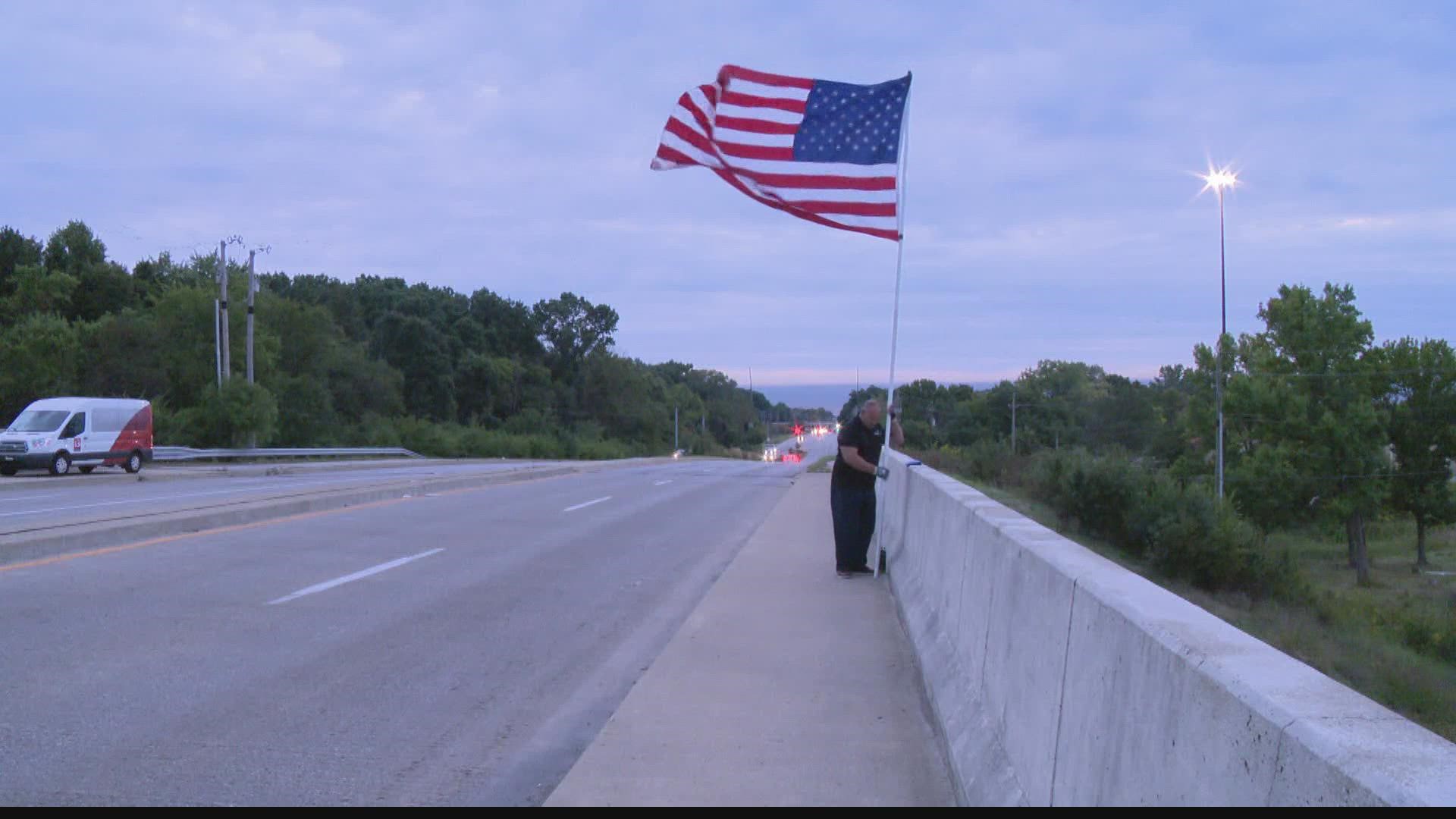 Giant American flag waves as drivers 
