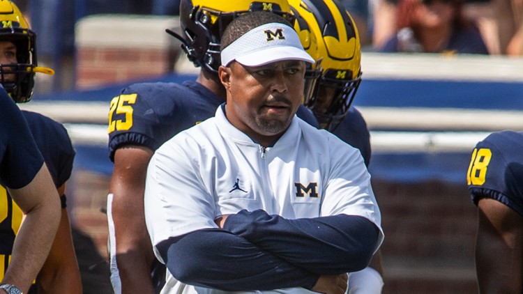 Michigan assistant coach Mike Hart carted off field on backboard during  game at IU 