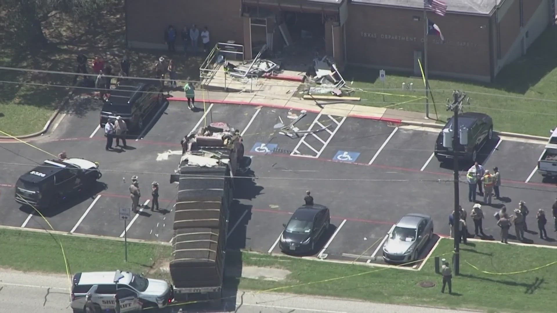 One person is dead and 14 others hurt after police say a man stole a semi and intentionally crashed into a public safety office in Texas.