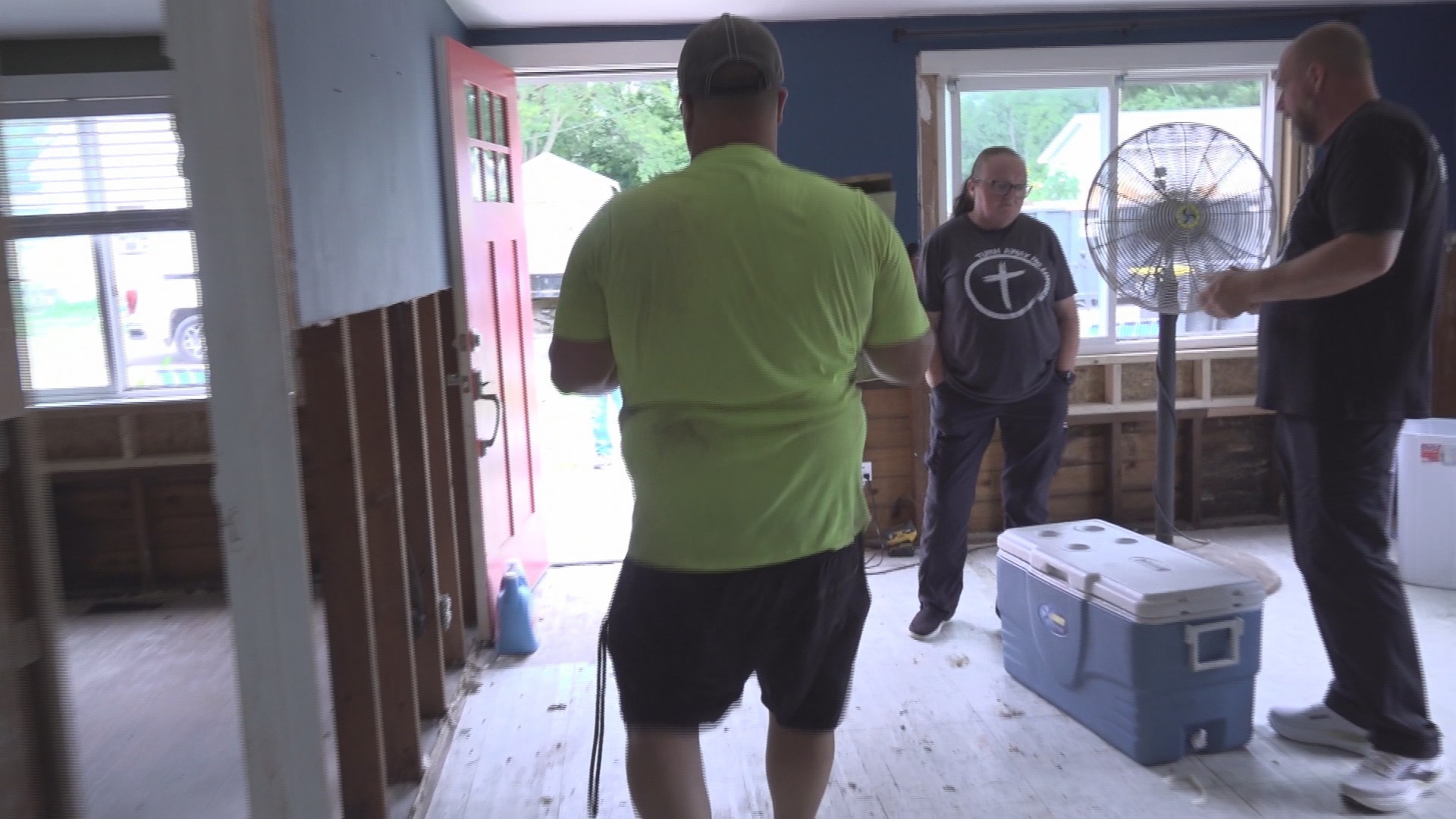 Flood victims around Anderson are helping others as volunteers assist in clearing damaged homes.