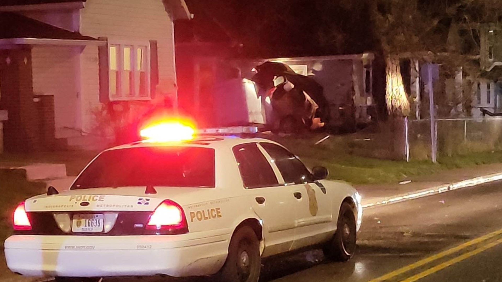 A car clipped a house before crashing into a trailer in the 1100 block of South State Avenue around 4:30 a.m. Thursday, police said.