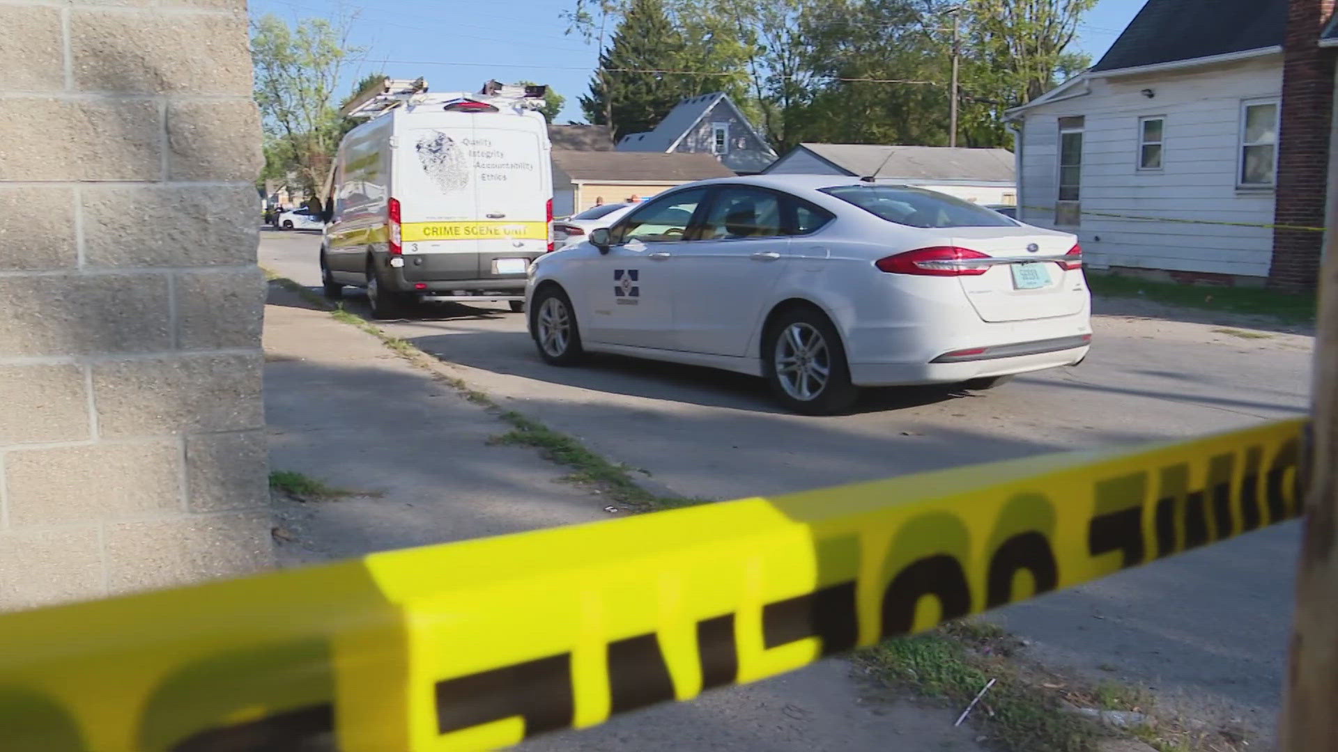 13News reporter Marina Silva talks with neighbors in the area of 12th Street and Tibbs Avenue following the fatal shooting Saturday afternoon.