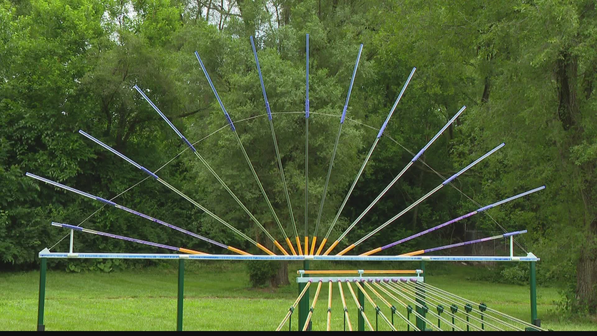 "Bending Light" is a permanent art installation that uses transparent acrylic rods to make light more visible and show how it bends.