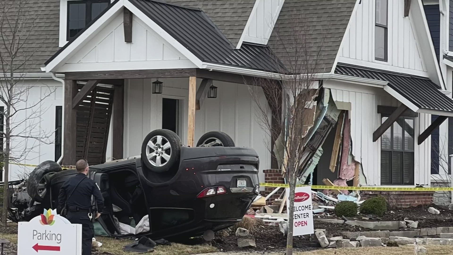 Police tell 13News they believe the SUV hit a fire hydrant and then crashed into the Estridge Homes office.