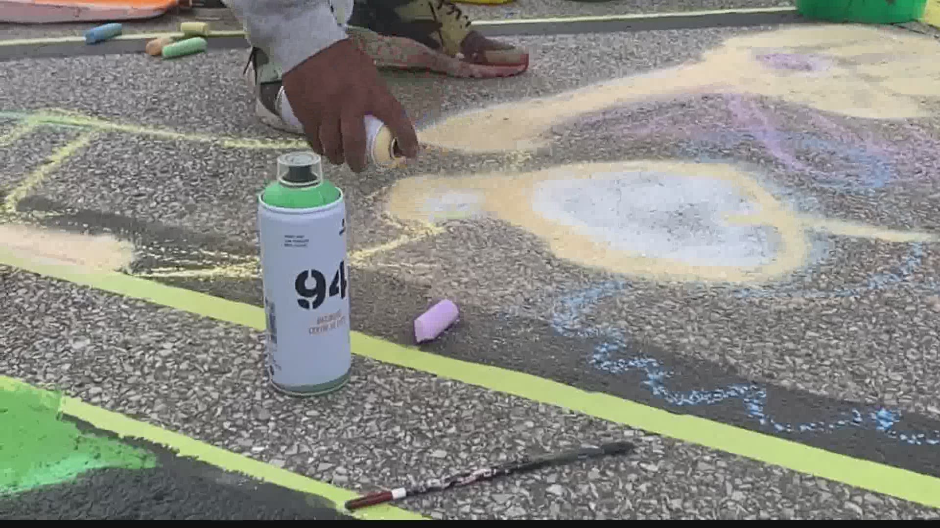 Indy is joining several cities with Black Lives Matter street murals with the help of 18 local artists.