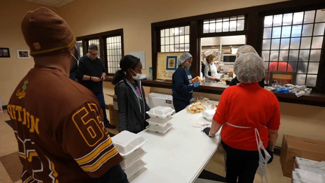 Mozel Sanders volunteers preparing thousands of Thanksgiving dinners