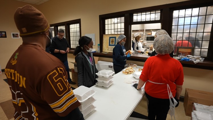 Mozel Sanders volunteers spend Thanksgiving preparing, sharing hot meals