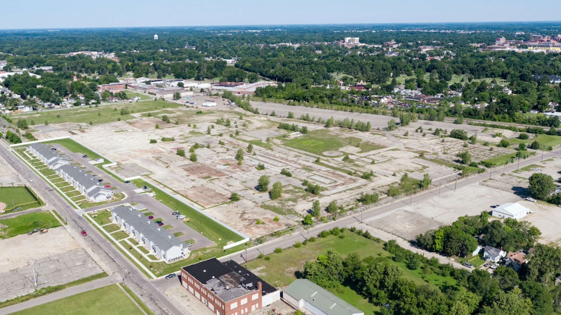 The deal with RACER Trust will give the city control of the 53-acre site at 1200 W. 8th St.