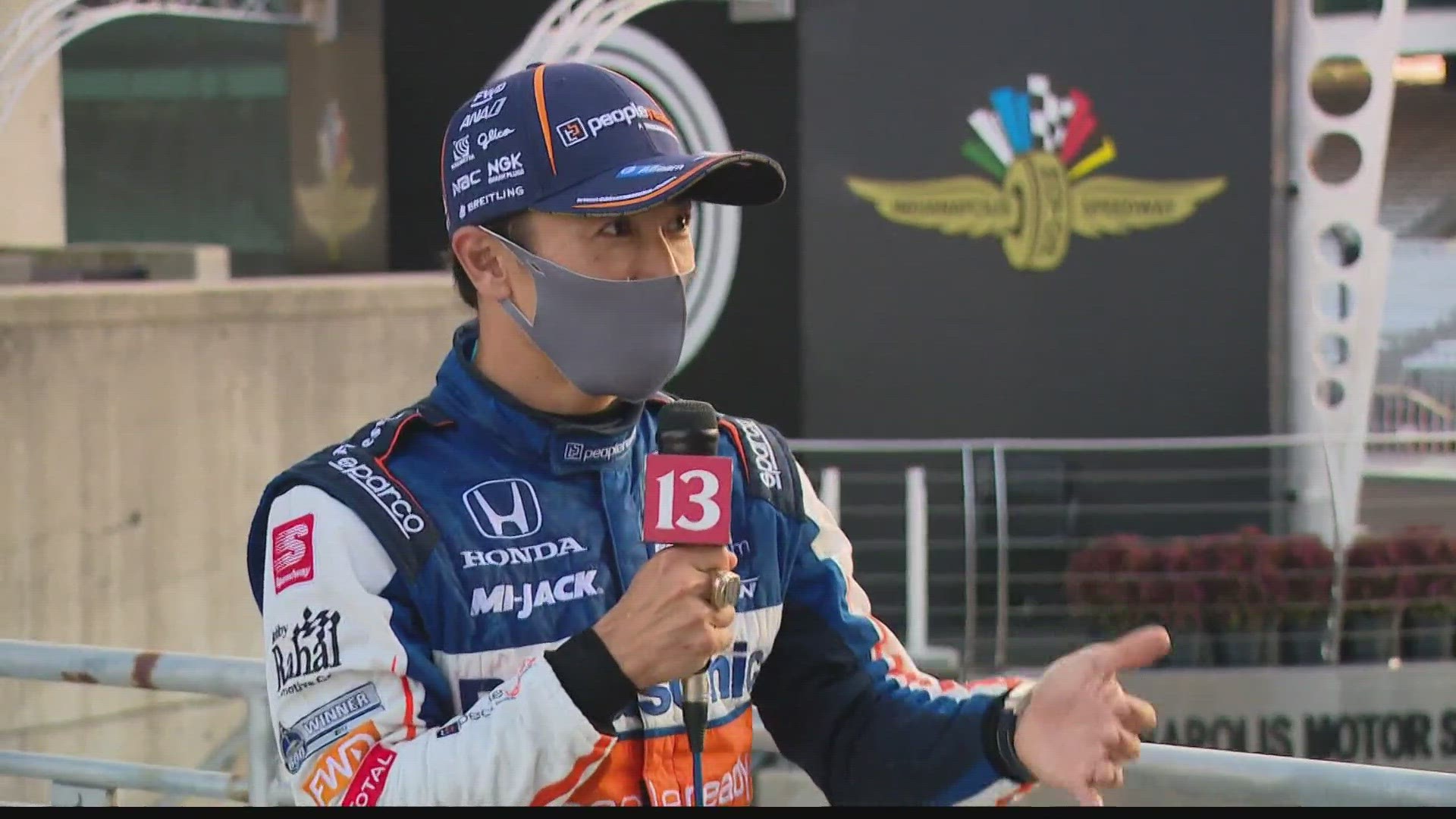 Two-time Indianapolis 500 champion Takuma Sato talks with Dave Calabro after Sunday's race.