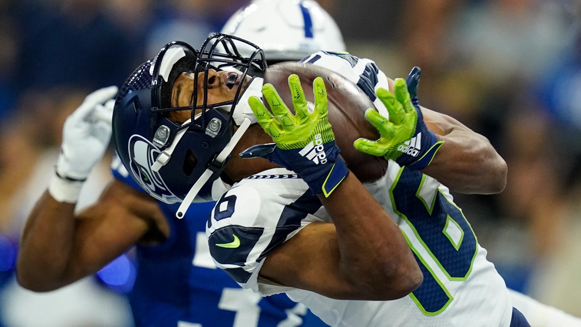 September 12, 2021: Seattle Seahawks running back Chris Carson (32) runs  with the ball during NFL football game action between the Seattle Seahawks  and the Indianapolis Colts at Lucas Oil Stadium in