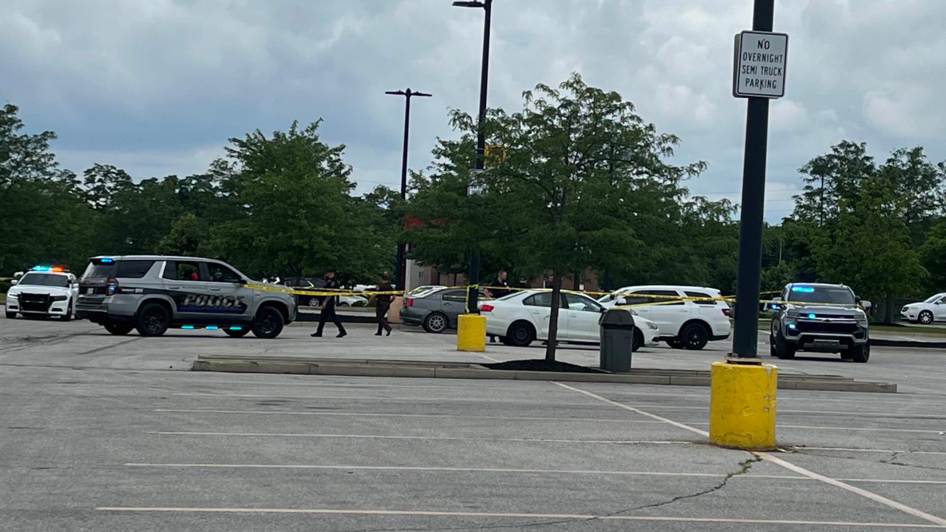 Witnesses told police two men got into a verbal and physical altercation in the parking lot of the store prior to shots being fired.