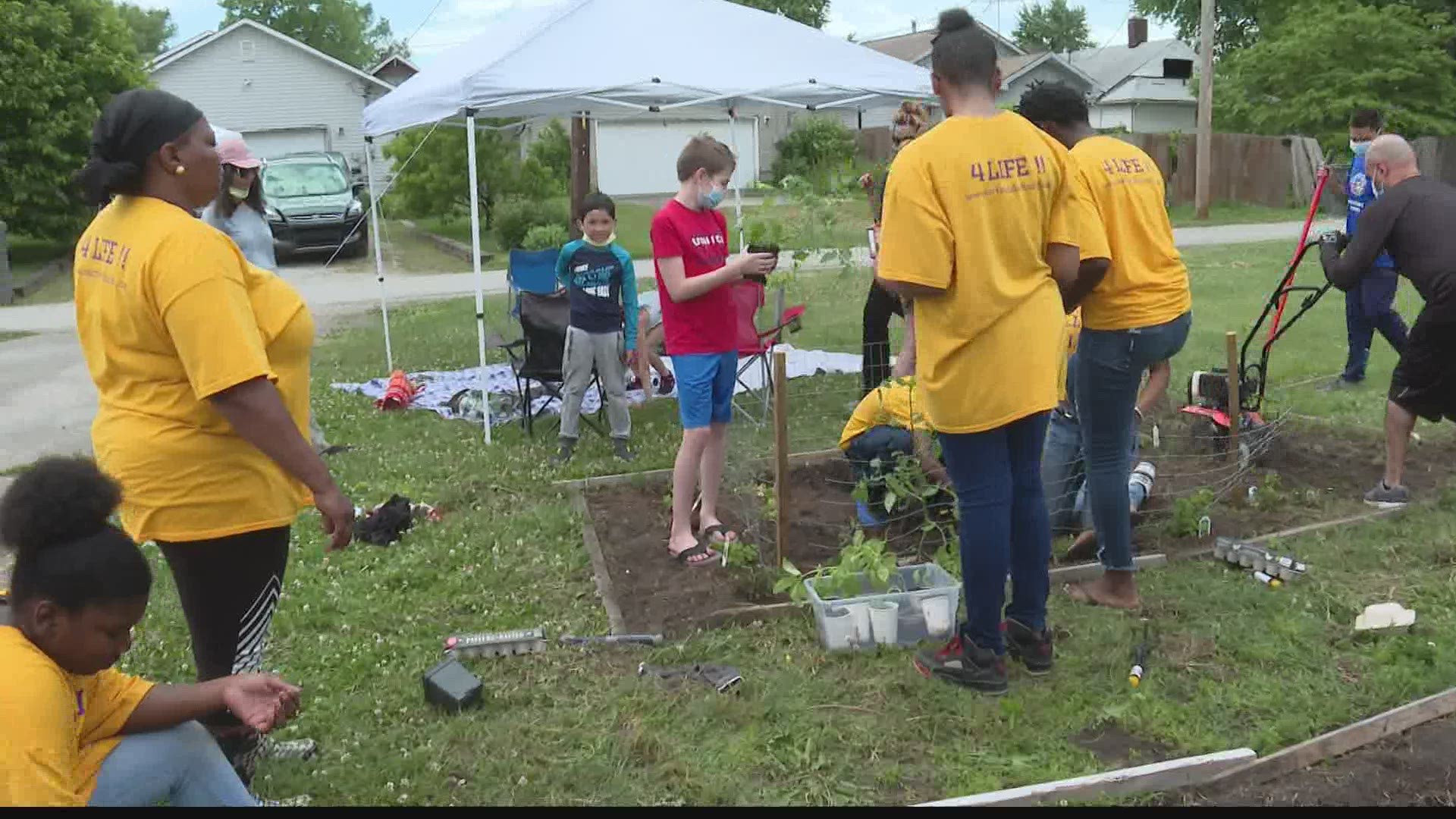 Two youth groups partnered to plant organic tomatoes, herbs, flowers, peppers and melons.