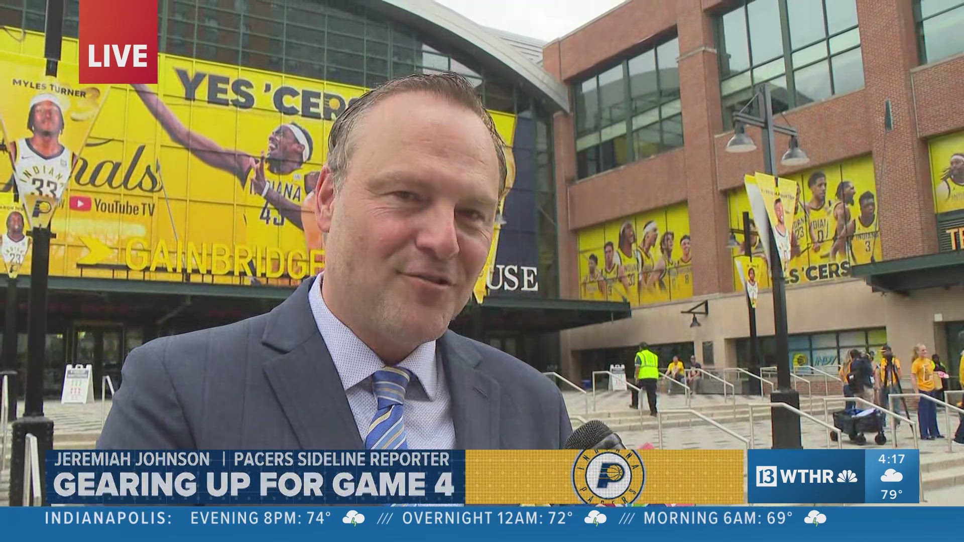 Jeremiah Johnson talks with 13News reporter Marina Silva outside Gainbridge Fieldhouse prior to Game 4 of the NBA Finals between the Pacers and Thunder.