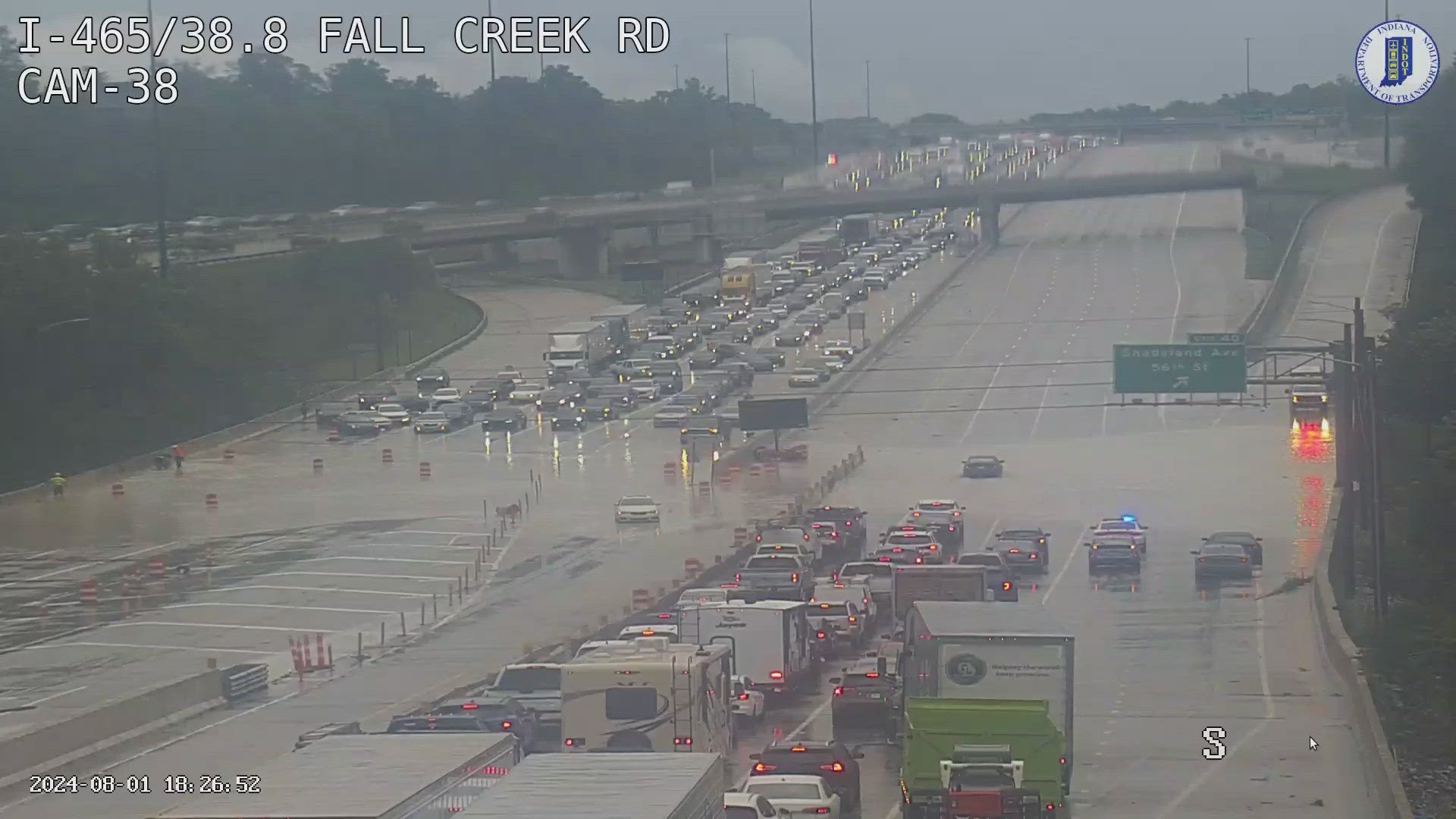 Interstate 465 came to a standstill around 6:15 p.m. Thursday as heavy rains flooded the roadway near Fall Creek Road on the northeast side of Indianapolis.