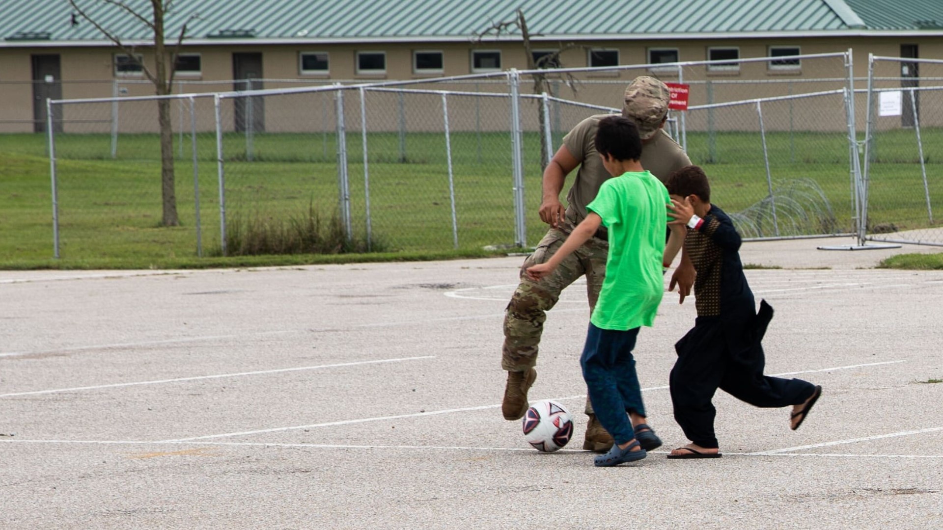 Soldiers at Camp Atterbury gave a group of Afghan children a warm welcome with a friendly soccer match on Saturday.