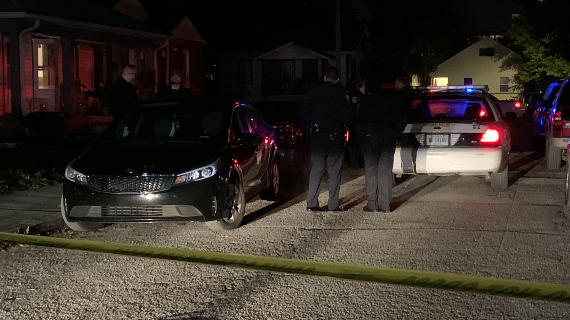 IMPD said two dogs charged at an officer, so the officer fired a shot at one of the dogs, striking it, as well as striking a person in the hand.