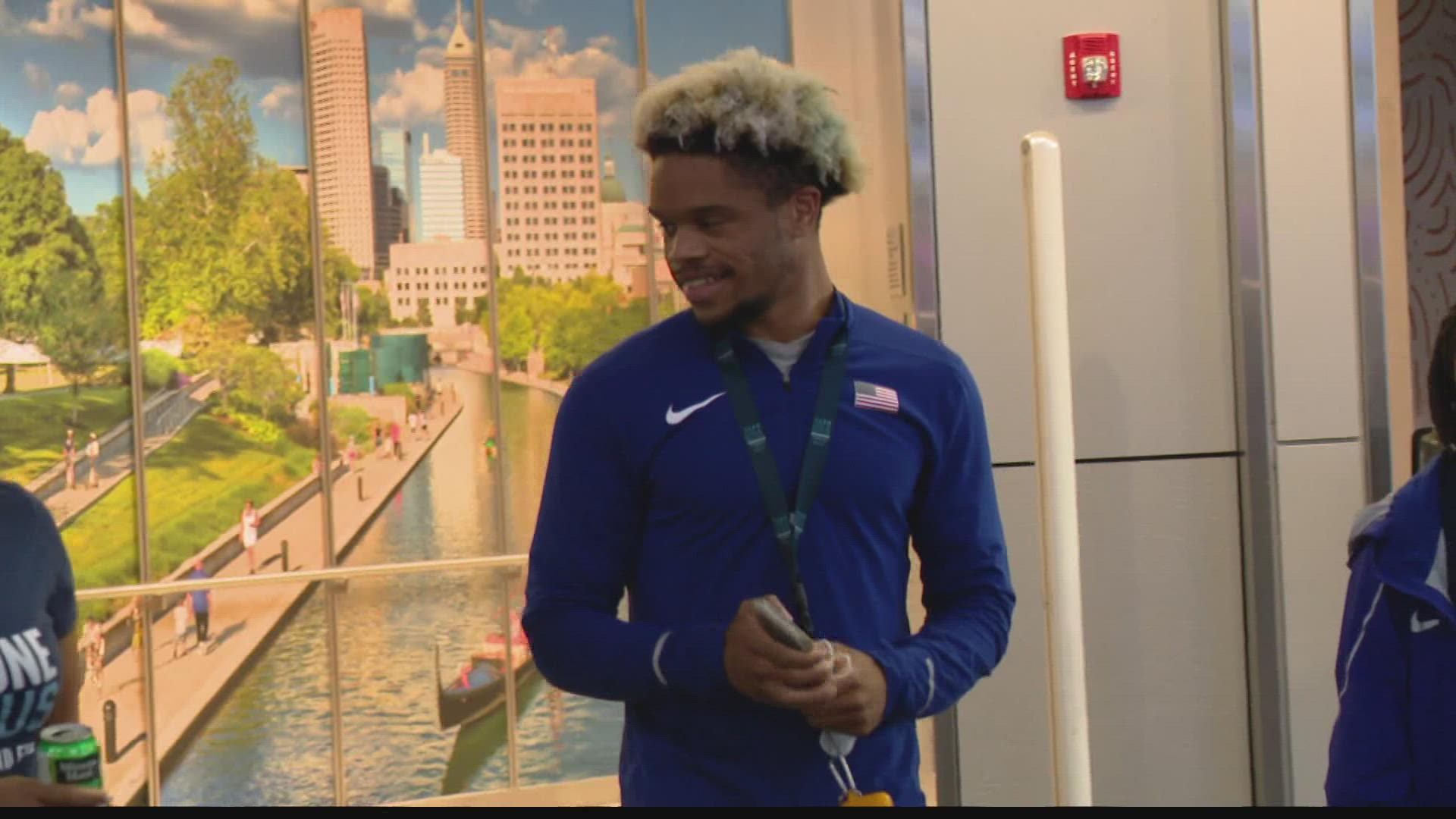 Friends and family greeted the three-time medalist when he got off the plane at Indianapolis International Airport Monday.