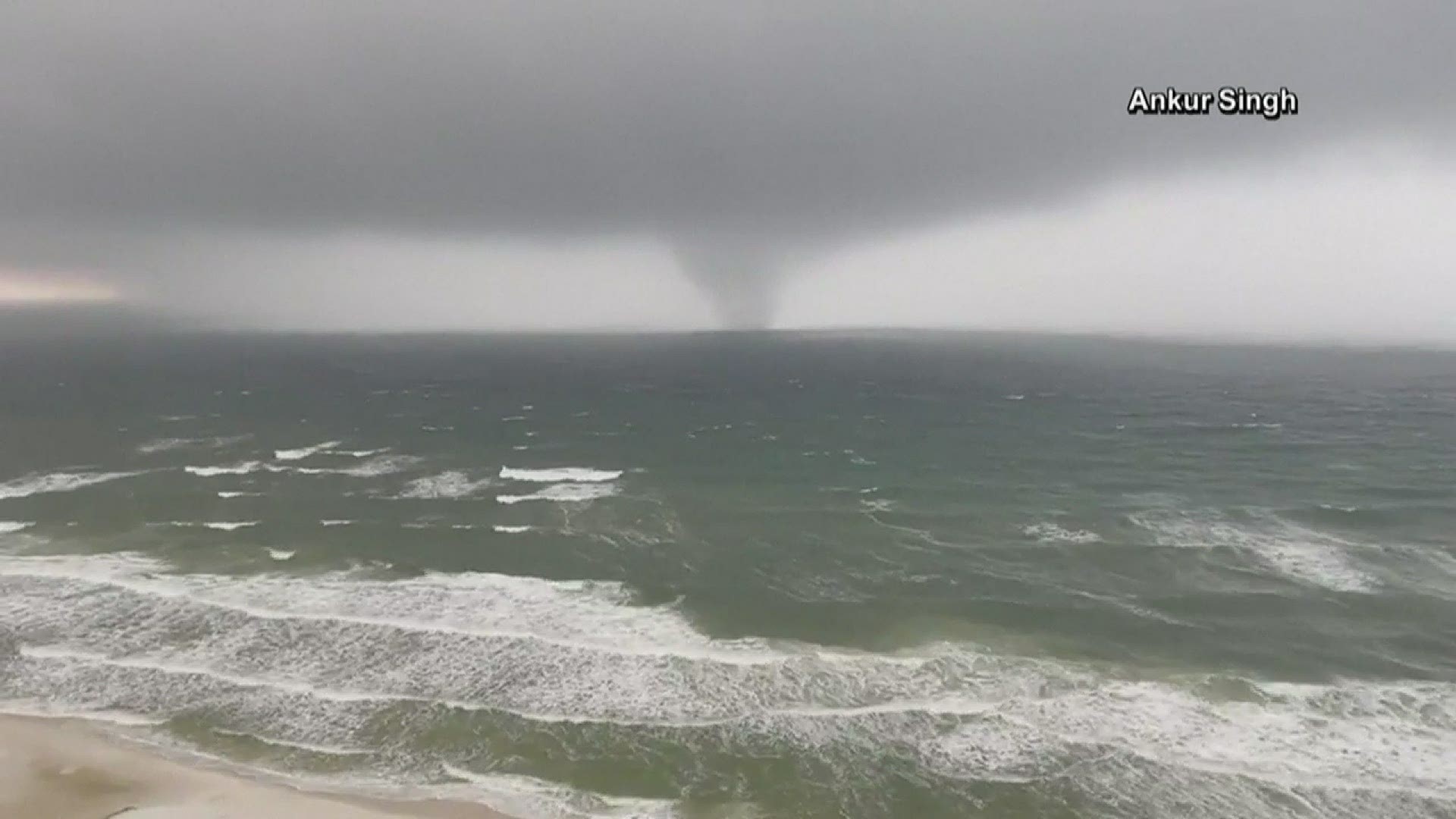 A tornado was seen moving with strong waves toward the shore in Panama City Beach, Florida on Saturday.