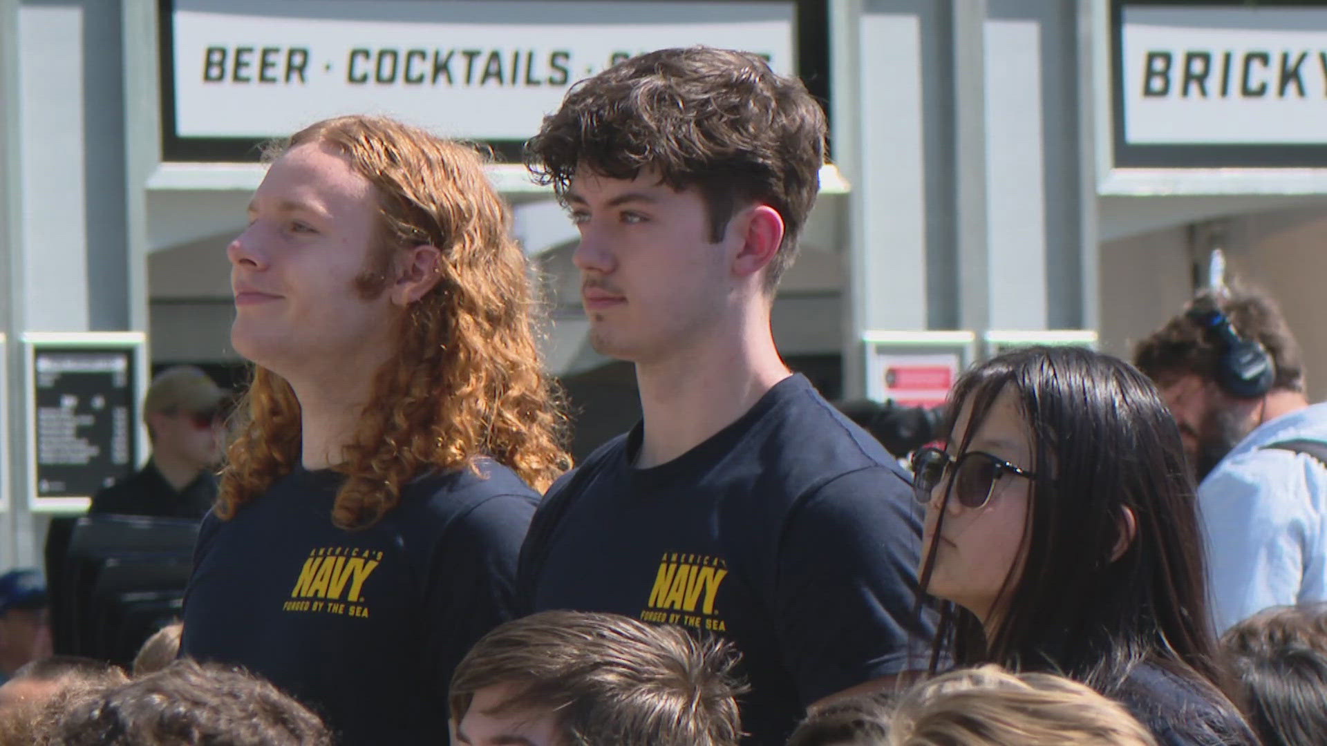 13News reporter Anna Chalker talks with some of the Hoosiers who enlisted in the military at the Indianapolis Motor Speedway on Sunday.