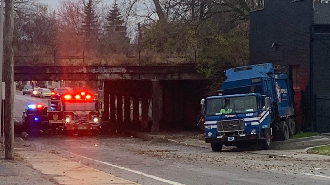 Trash truck catches fire after hitting New York Street bridge