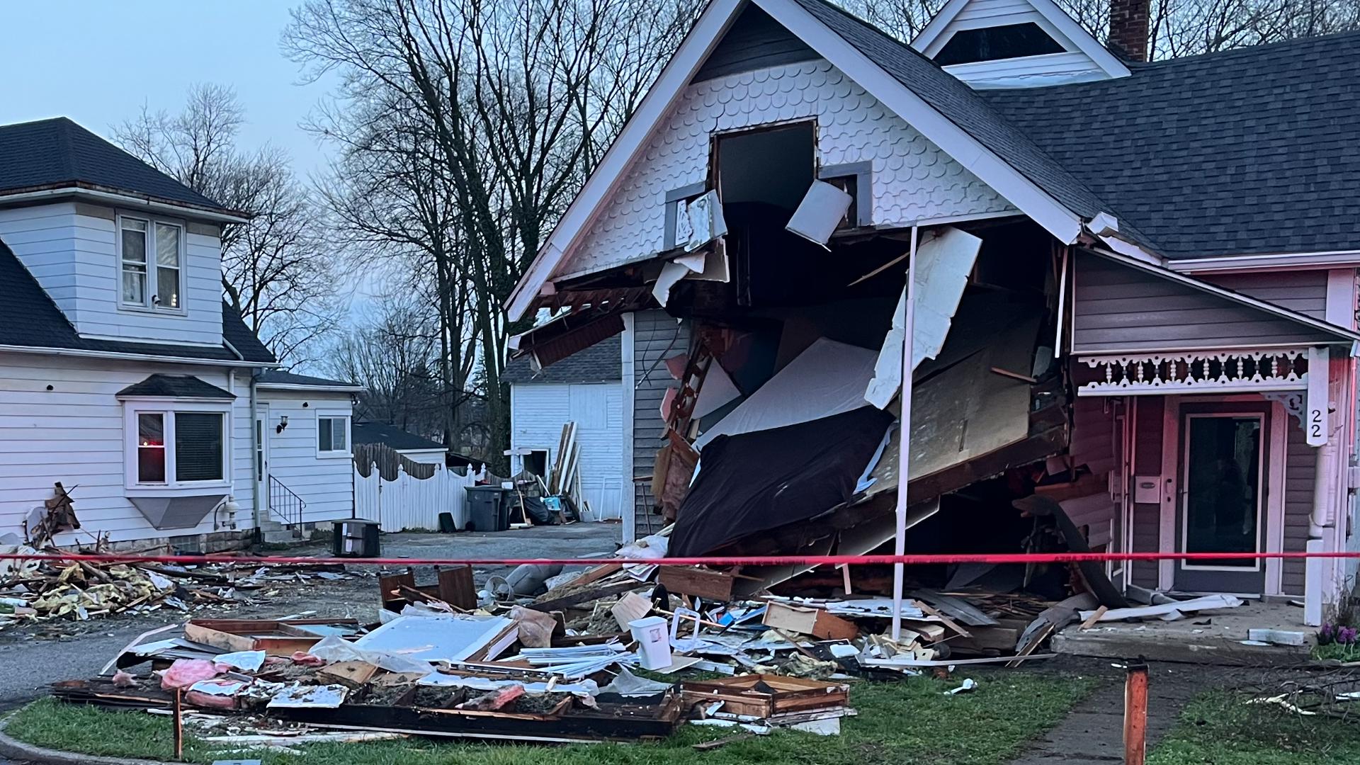 Driver hospitalized after pickup truck crashes into 2 homes on ...