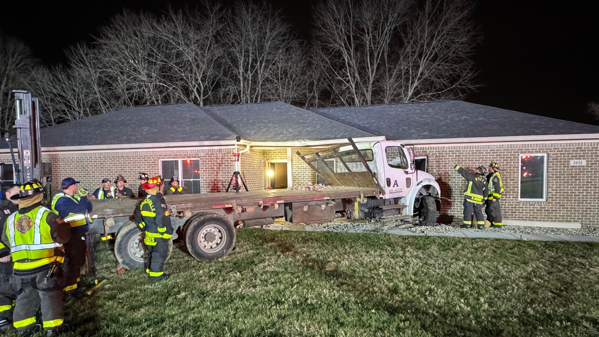 A fire department spokesperson said the driver of the truck was taken to a hospital to be checked for injury.