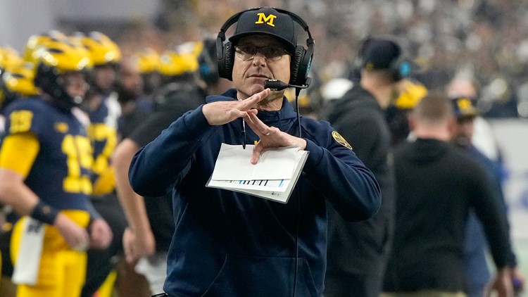 Jim Harbaugh calls Michigan president to say he's staying