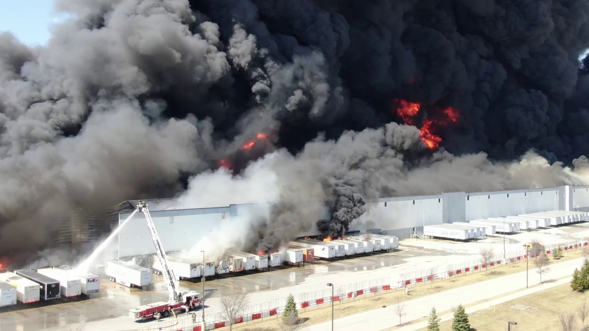 Drone video shows explosions and the center of the warehouse collapsed after a massive fire March 16, 2022.