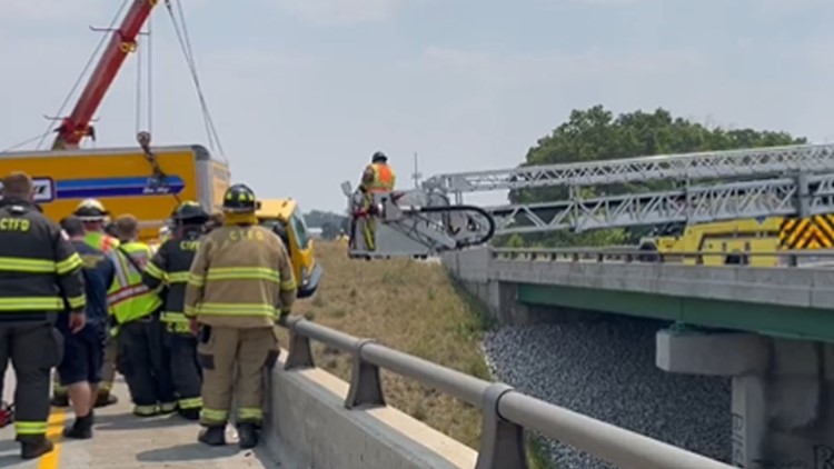 Scary video shows firefighters rescue man, woman trapped in truck dangling over Indiana bridge
