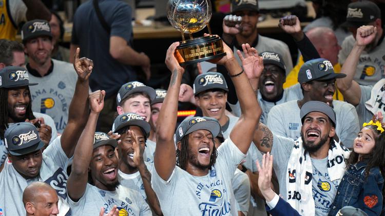 Pacers handing out fan gear bags on Pennsylvania Street Wednesday