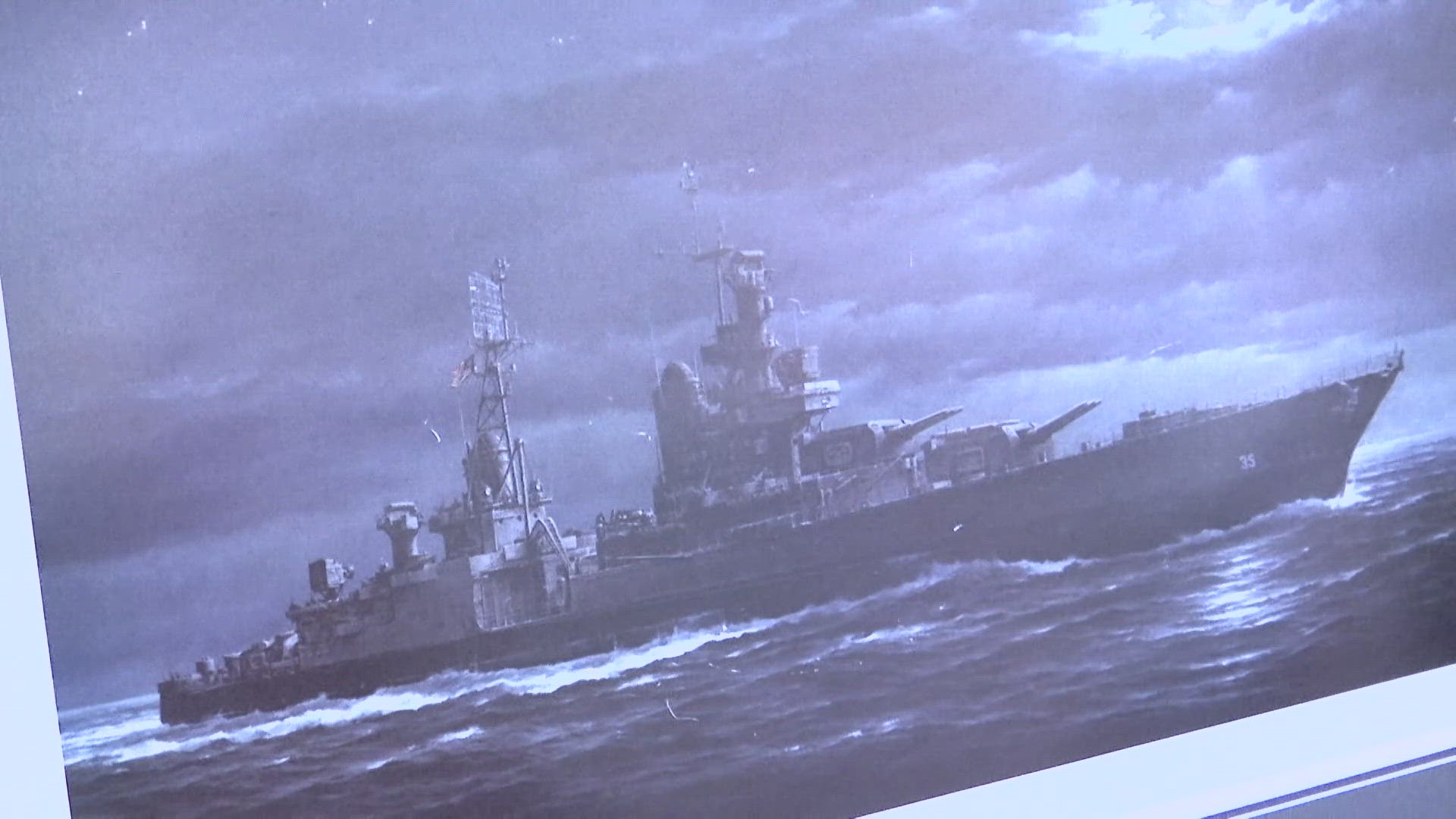 It was torpedoed by a Japanese submarine and sank within minutes in shark-infested waters. 