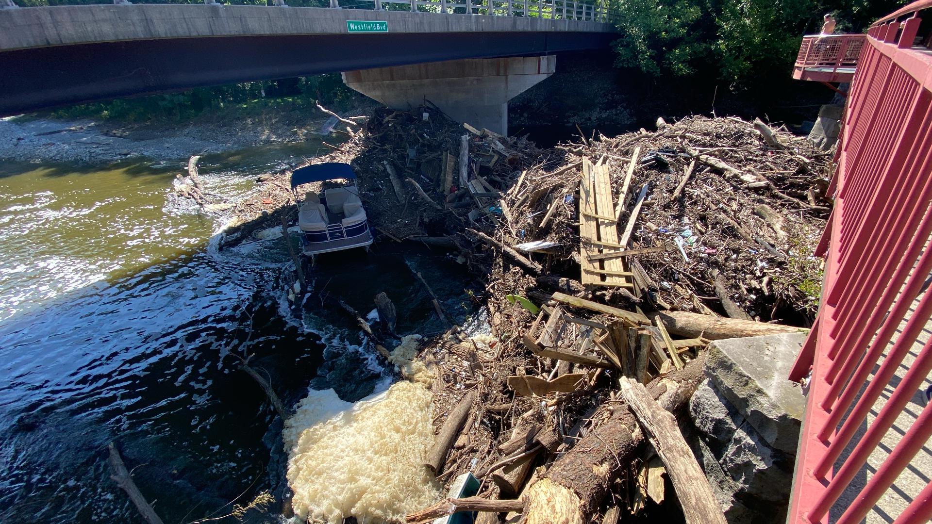 Massive debris pile grows on the White River north of Broad Ripple