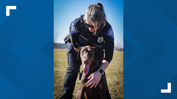 Dog found with zip tie around snout adopted by police officer who saved him