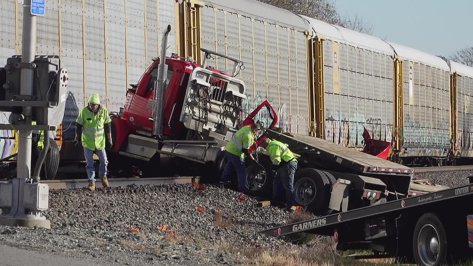 The driver saw a train coming and got out before the semi was hit.