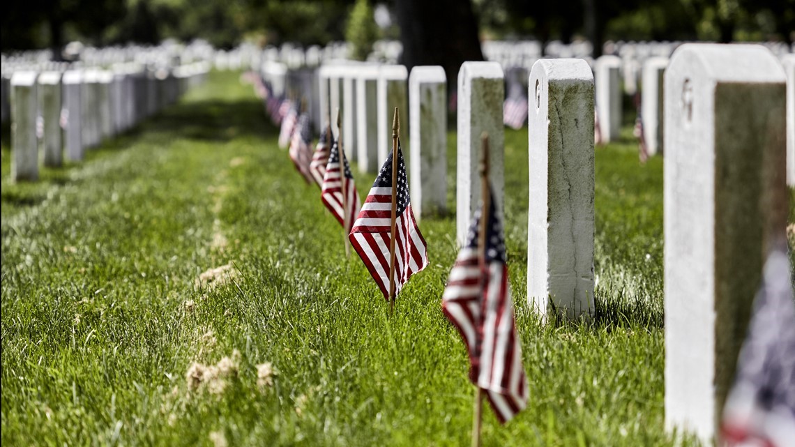 Marlborough scouts place flags on veterans' graves