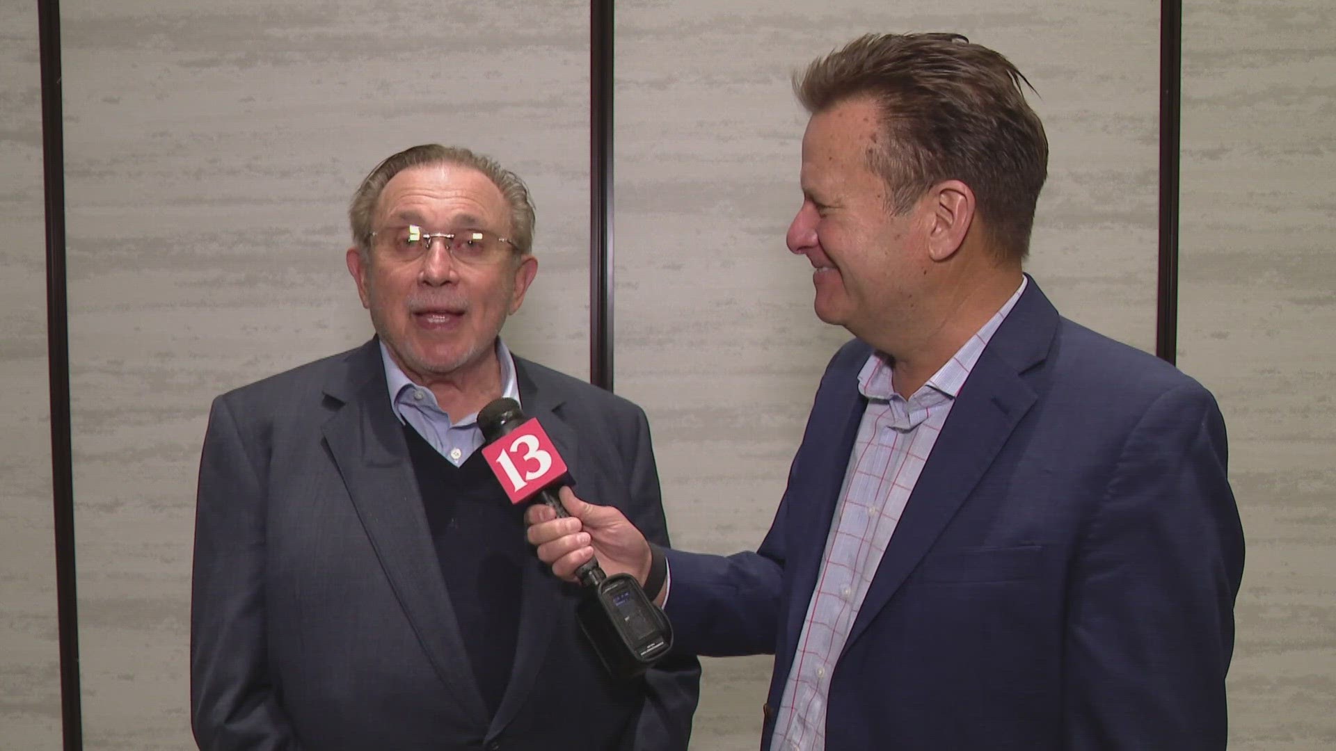 13Sports director Dave Calabro talks with Indiana Pacers owner Herb Simon following his induction into the Naismith Basketball Hall of Fame.