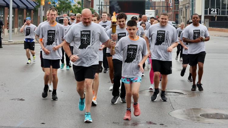 Special Olympians, police run torch through Indianapolis ahead of Summer Games