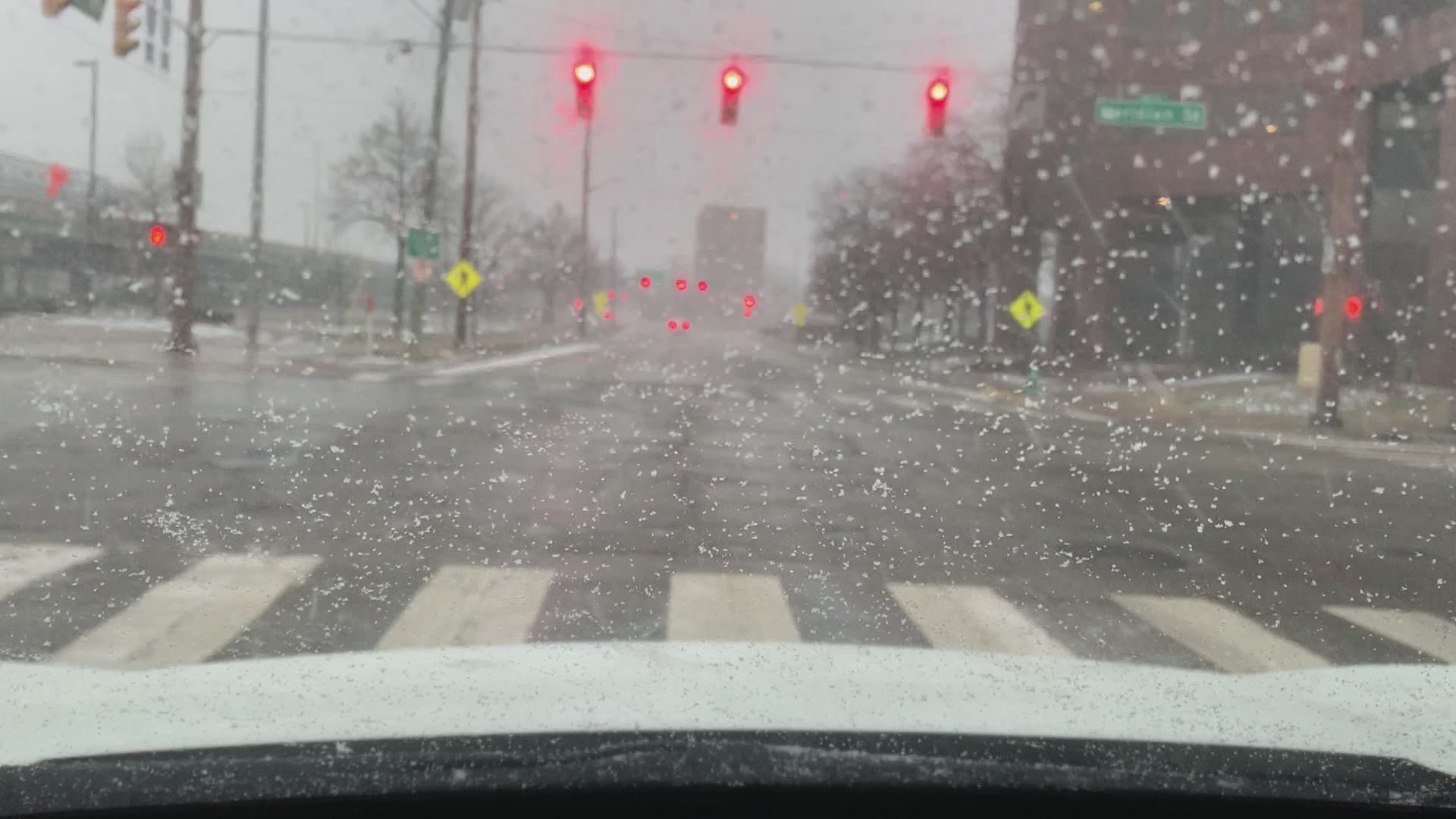 Some roads in downtown Indianapolis are becoming snow-covered.