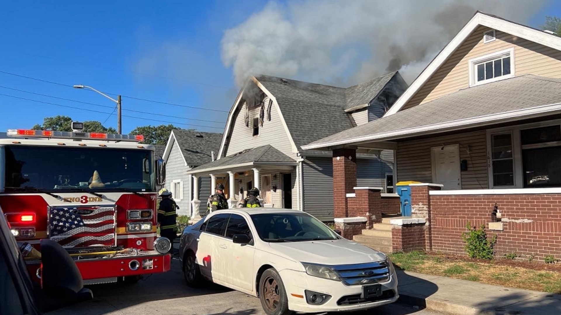 The firefighters were battling a house fire on the southeast side Sunday morning.