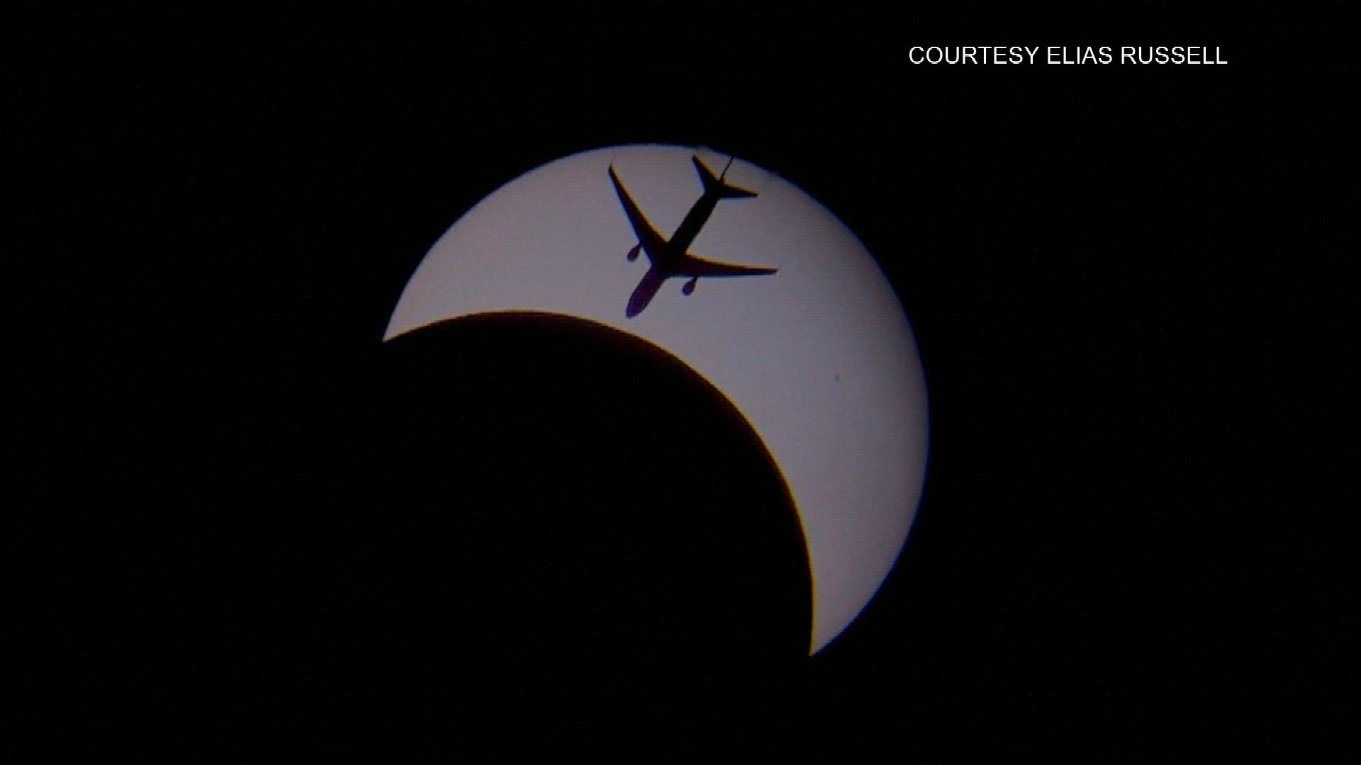 Elias Russell, a high school student from Michigan, was recording video and taking photos of the eclipse through his telescope as the moon passed in front of the sun