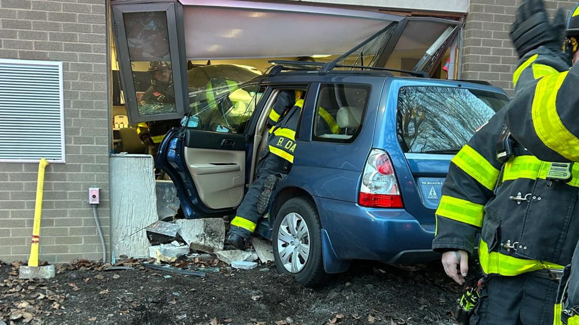 Child taken to hospital after car crashes into school on Indy's ...