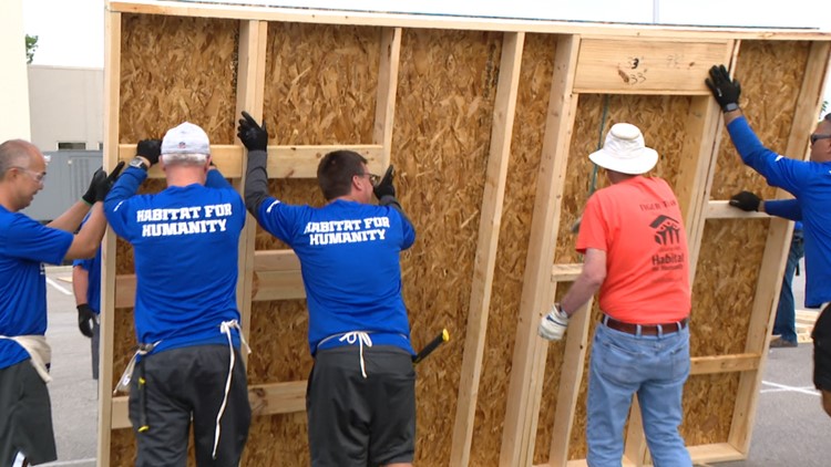 Colts coaches join Habitat for Humanity to build family's home