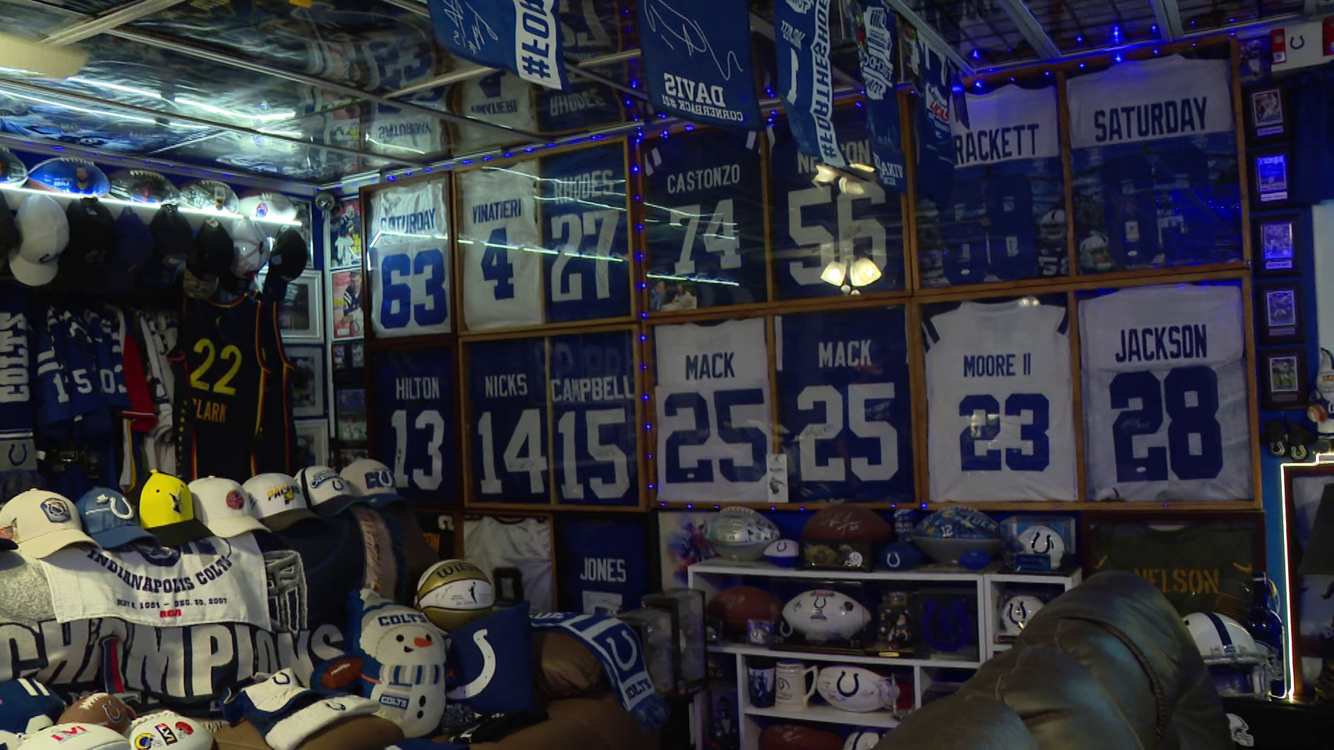 Signed jerseys, hats and cards cover every inch of Rick Stevens' ceiling and walls in his "Colts Cave."