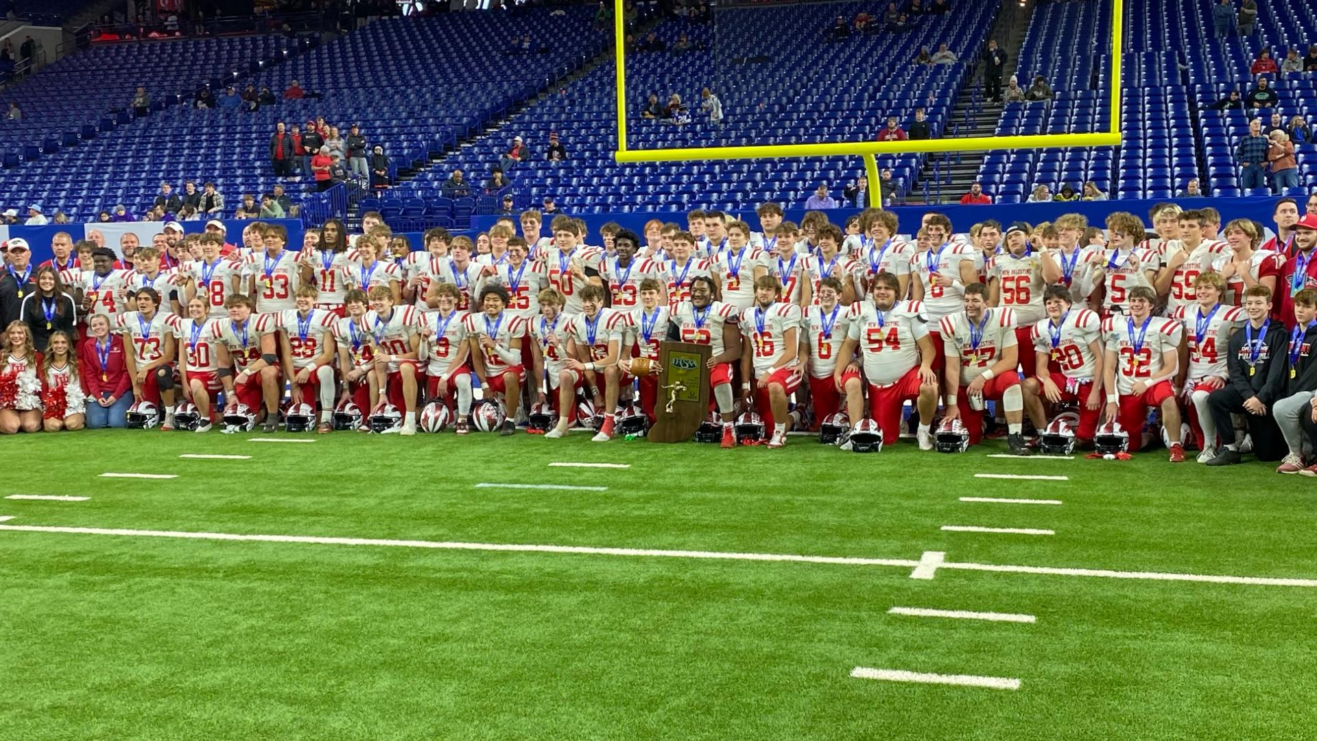 New Palestine beat East Noble 56-26 to claim the fourth state football championship in school history.