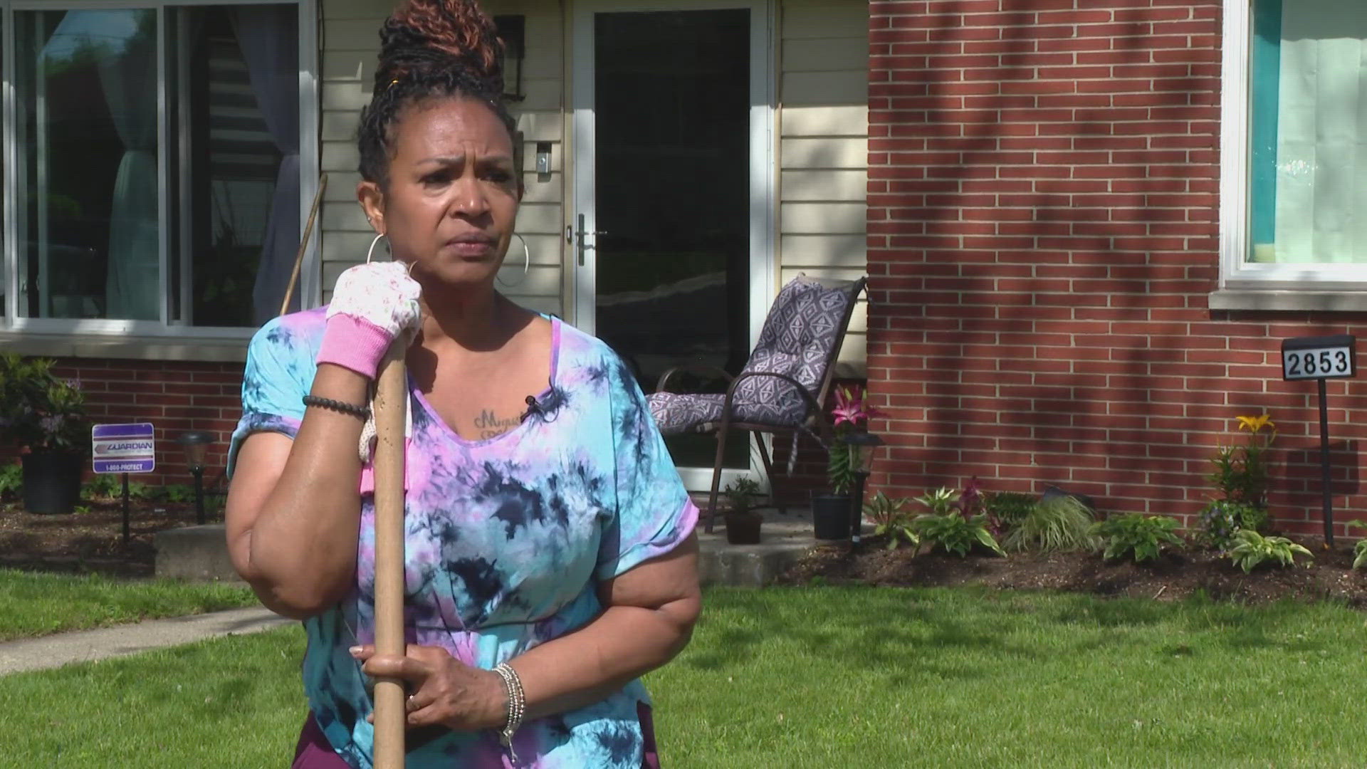 13News reporter Logan Gay talks with a neighbor to one of the shootings Saturday morning.